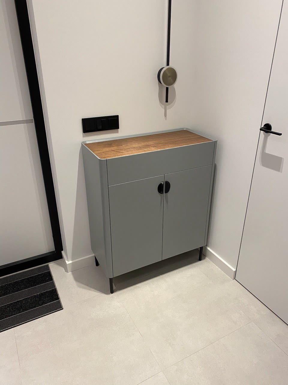 Compact cabinet on steel legs