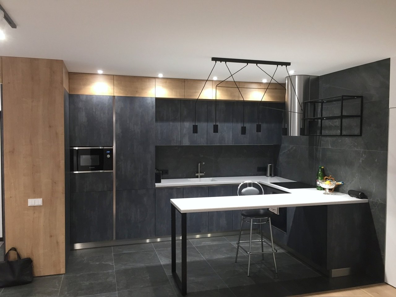 Dark kitchen with breakfast bar
