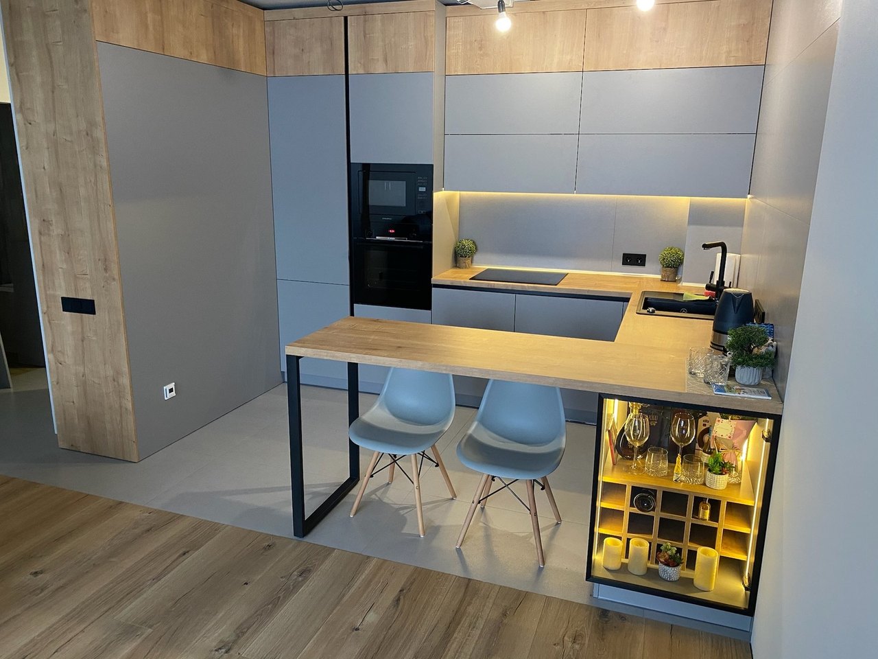 Breakfast bar with lit wine cabinet