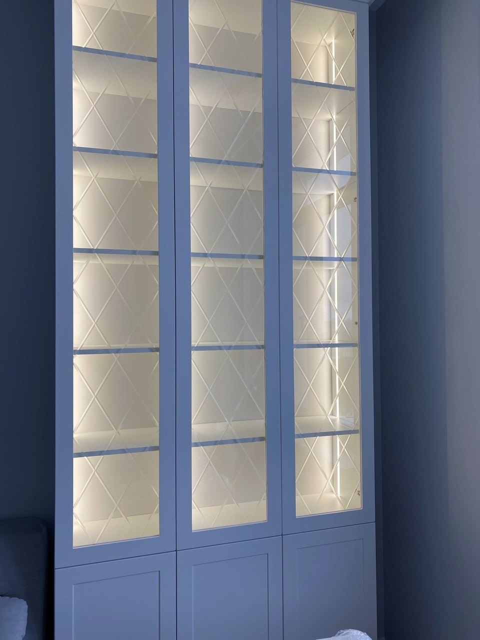 Glass-front cabinets with built-in lighting